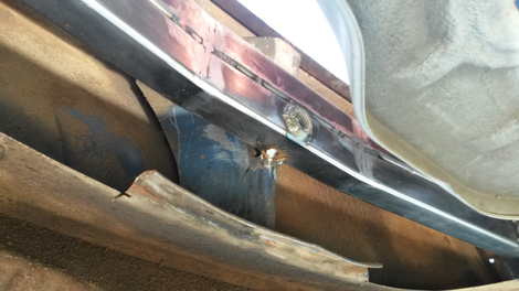 The rear of the car, where there’s a gap to be filled between the Miata body below and the Volkswagen’s crash bar above.